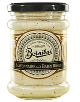 Bornibus Mayonnaise mit rosa Beeren im Glas mit schwarzem Schraubdeckel.