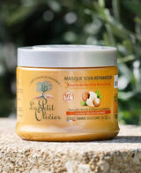 Le Petit Olivier Haarmaske für trockenes Haar mit Sheabutter und Macadamia auf einer Steinfläche