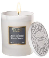 Collines de Provence Duftkerze Ebenholz (180 g) im matten weißen Glas mit silberfarbenem Deckel aus Pflanzenwachs für eine warme, holzige und elegante Raumatmosphäre.