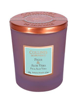 Collines de Provence Duftkerze Feige und Aloe Vera im violetten Glas mit kupferfarbenem Metalldeckel auf hellem Hintergrund.