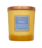 Collines de Provence Duftkerze Neroli & Baumwollblüte in gelbem Glas mit kupferfarbenem Deckel und blauem Etikett