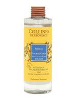 Collines de Provence Nachfüllung für Duftdiffuser Neroli & Baumwollblüte in transparenter Flasche mit gelbem Etikett