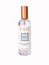 Collines de Provence Raumspray Aloe Vera in transparenter Glasflasche mit weißem Etikett und kupferfarbenem Verschluss auf hellem Hintergrund.