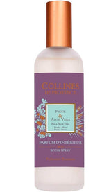 Collines de Provence Raumspray Feige und Aloe Vera in mattierter Glasflasche mit violettem Etikett und kupferfarbenem Verschluss auf hellem Hintergrund.