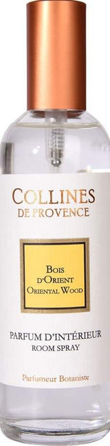 Collines de Provence Raumspray Orientalisches Holz (100 ml) in einer eleganten Glasflasche mit kupferfarbenem Verschluss für einen warmen, holzig-orientalischen Raumduft.