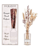Durance Floral Reed Diffuser Fleur de Coton Duftdiffuser mit Trockenblumen im Glasflakon neben Verpackung 