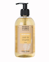 Flüssigseife von marius fabre mit dem duft honig in einer spenderflasche
